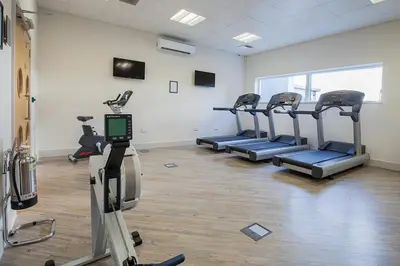 a gym with several tread machines in a room at 4 Bed in Lelant oc-a30881 in Carbis Bay