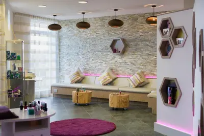 a living room with a couch and a brick wall at 55 Una in Carbis Bay