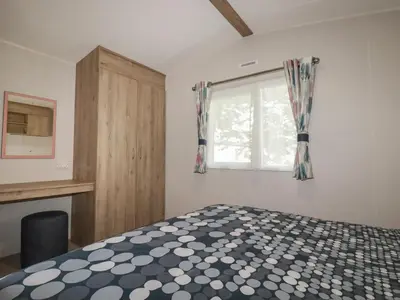 a bedroom with a bed and a window at 82 Hillside in Newquay