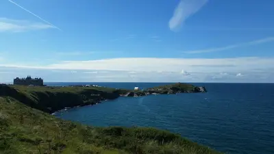 a large body of water with an island in it at Headland Hideaway, Fistral Beach Newquay, Cornwall in Newquay