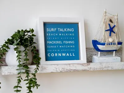 a picture of a sign on a shelf at Atlantic Hideaway, Fistral Beach, Newquay Cornwall in Newquay