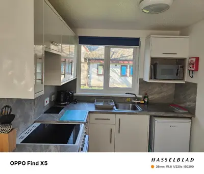 a small kitchen with a sink and a window at Tolroy manor holiday cottage in Saint Erth