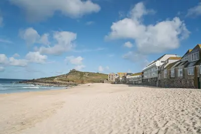 a view of a beach with houses and the ocean at 11 Piazza in St Ives