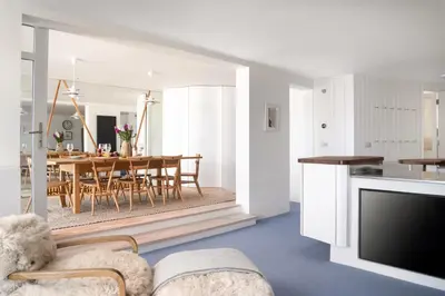 a living room with a table and a dining room at 11 Piazza in St Ives