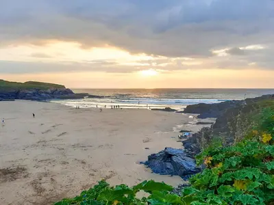 a beach with a group of people on the sand at Atlantic Retreat in Padstow