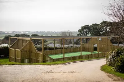 a house with a tennis court inside of it at The Vacation, Cozy Static Caravan in Newquay in Newquay