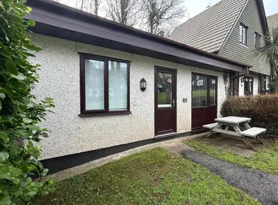 a house with a picnic table in front of it at 85 Strawberry Hill Hayle in Hayle