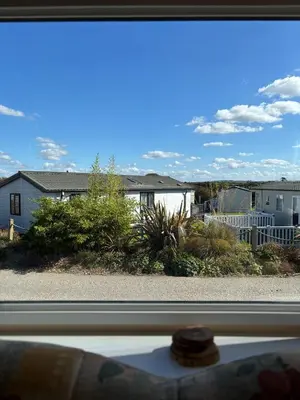 a view from a window of a house at Seaside Escape 2-Bed Caravan at Seven Bays Park in St Merryn