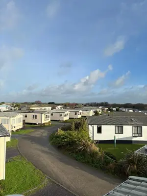 arial view of a caravan park with white houses at Seaside Escape 2-Bed Caravan at Seven Bays Park in St Merryn
