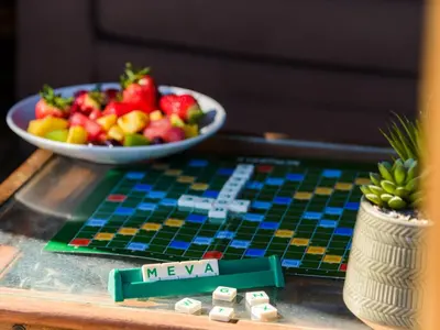 a table with a bowl of fruit and a plate of food at Holiday Home Lighthouse Watch by Interhome in Mevagissey