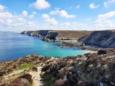 a view of a body of water with rocks at Wheal Rock - Luxury 2 Bed Lodge in St. Agnes