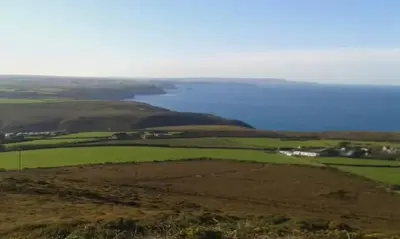 a view of a hill with a large body of water at One bed spectacular ocean views, walk to the beach in Truro