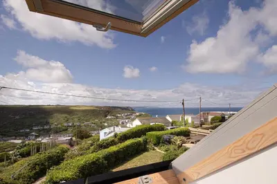 a view of the ocean from the balcony of a house at One bed spectacular ocean views, walk to the beach in Truro