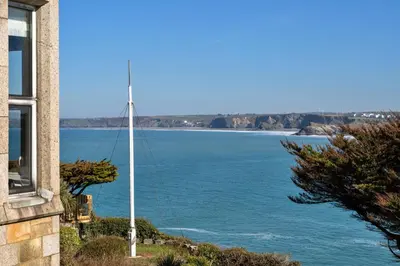 a view of the ocean from a house at Finest Retreats - Tidal Shores in Newquay