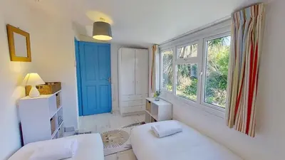 a living room with a white couch and a window at B12 Branksome, Riviere Towans in Hayle