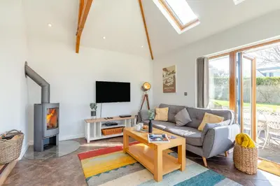 a living room with a couch and a tv at 5 Bed in Trevone oc-s30762 in Padstow