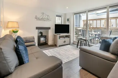 a living room with a couch and a television at 2 Bed in St. Ives oc-k30934 in Carbis Bay
