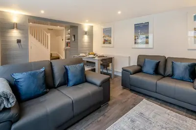 a living room with two couches and a table at 2 Bed in St. Ives oc-k30934 in Carbis Bay
