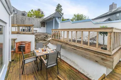 a patio with a table and chairs on a deck at 2 Bed in St. Ives oc-k30934 in Carbis Bay