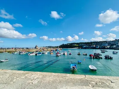 a bunch of boats are in the water at Ideally located cottage in Downalong St Ives in St Ives