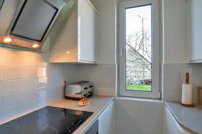a kitchen with a toaster on a counter and a window at Finest Retreats - Chy Merthen House in Marazion