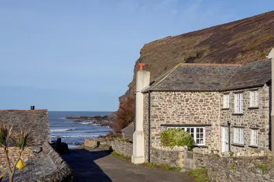 an old stone house with a view of the ocean at Penkenna House - magical home and location Saturday to Saturday bookings only 7 night min July to October in Crackington Haven