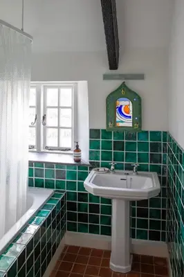 a green tiled bathroom with a sink and a tub at Penkenna House - magical home and location Saturday to Saturday bookings only 7 night min July to October in Crackington Haven