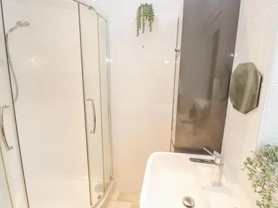 a bathroom with a shower and a sink at Chy Benyngoth in Hayle