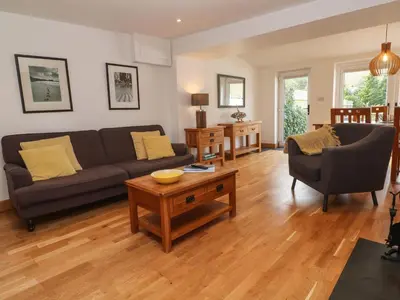 a living room with a couch and a table at Anneth Lowen in Hayle