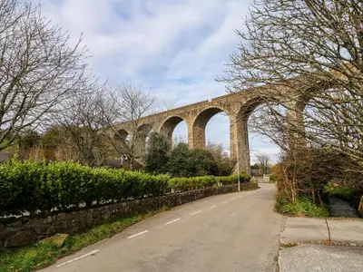 a bridge over a road next to a street at Anneth Lowen in Hayle