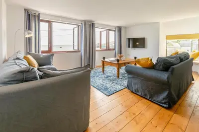 a living room with two couches and a table at 3 Bed in Coverack oc-b31082 in Coverack