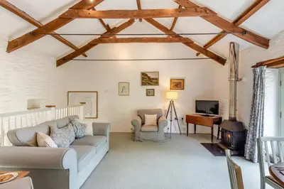 a living room with a couch and a tv at 2 Bed in Launceston oc-f30999 in Lewannick