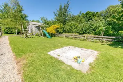 a playground with a toy in the grass at 3 Bed in Launceston oc-l31001 in Lewannick