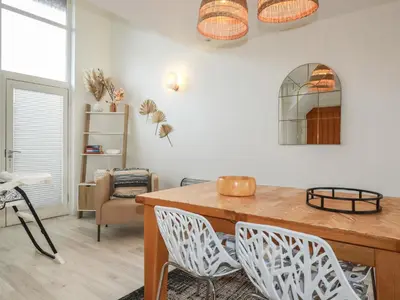 a dining room with a wooden table and chairs at Trenethick in Truro