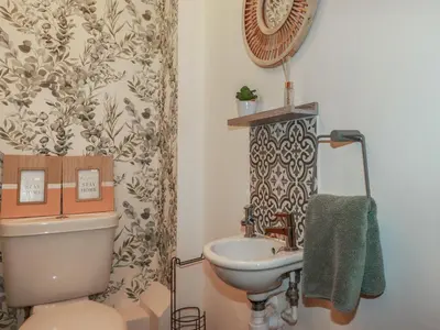 a bathroom with a toilet and a sink at Trenethick in Truro