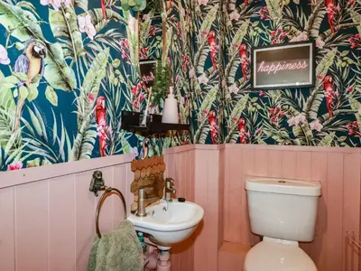 a bathroom with a toilet and a sink at Treveglos in Truro