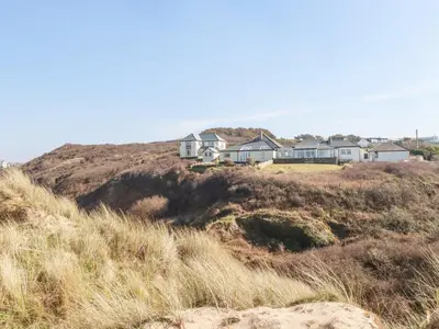 a row of houses on top of a hill at 1 Atlantic View in Newquay