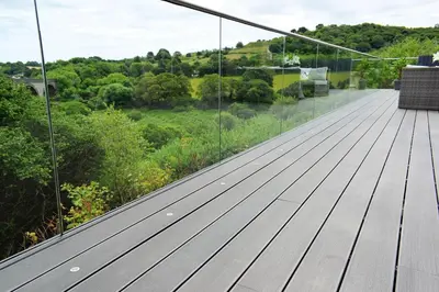 a glass roof on a house with a view at Riverview Modern 2 Bed- Parking & Tesla charger in Penryn