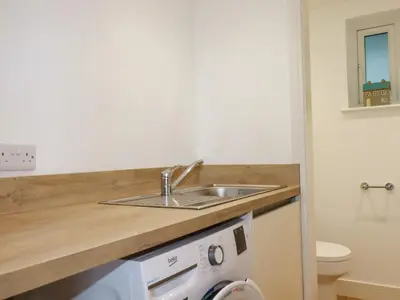 a bathroom with a sink and a toilet at Jacana in Perranporth