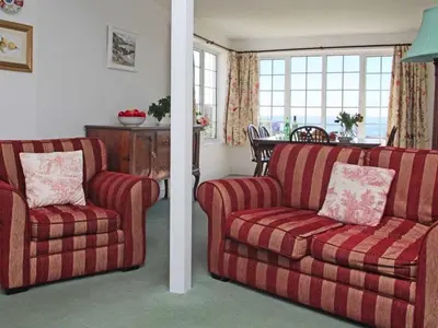 a living room with a couch and a chair at Watchtower in Torpoint