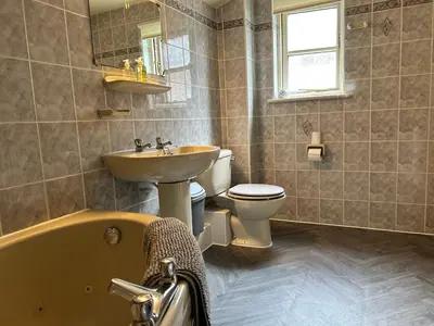 a bathroom with a sink and a toilet and a tub at Looe, Cornwall, Cottage, couples, romantic, quiet location, views, reliable Wi-Fi in Looe