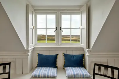 two pillows sitting in front of a window at Finest Retreats - St Eval School House in Saint Ervan