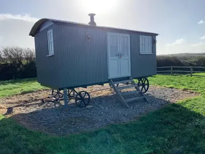 a tiny house on a stand in a field at Finest Retreats - St Eval School House in Saint Ervan