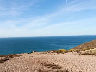 a view of the ocean from the top of a hill at Stargazy Skies in St. Agnes