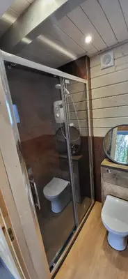 a small bathroom with a toilet and a sink at Sea La Vie in Perranporth