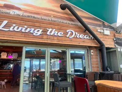 a restaurant with a sign that reads living the dream at Sea La Vie in Perranporth