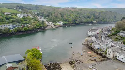 an aerial view of a town next to a river at 2 Bed in Fowey oc-o31260 in Fowey