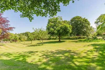 a park with trees and a grassy field at 2 Bed in Launceston oc-d31000 in Lewannick