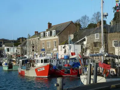 a group of boats docked in a harbor at Birdsong in St. Issey