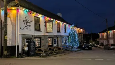 a christmas tree on the side of a building at The Star Inn in Saint Erth